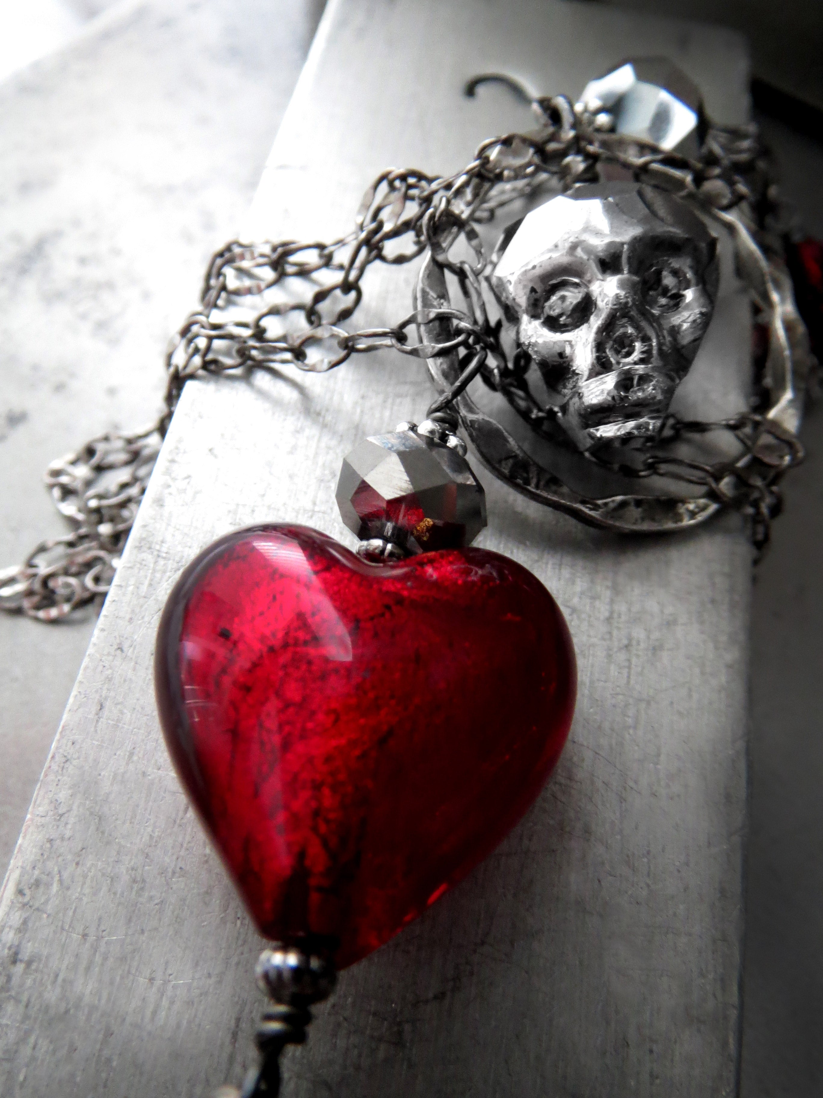 Metallic Silver Skull Necklace with Blood Red Heart Pendant