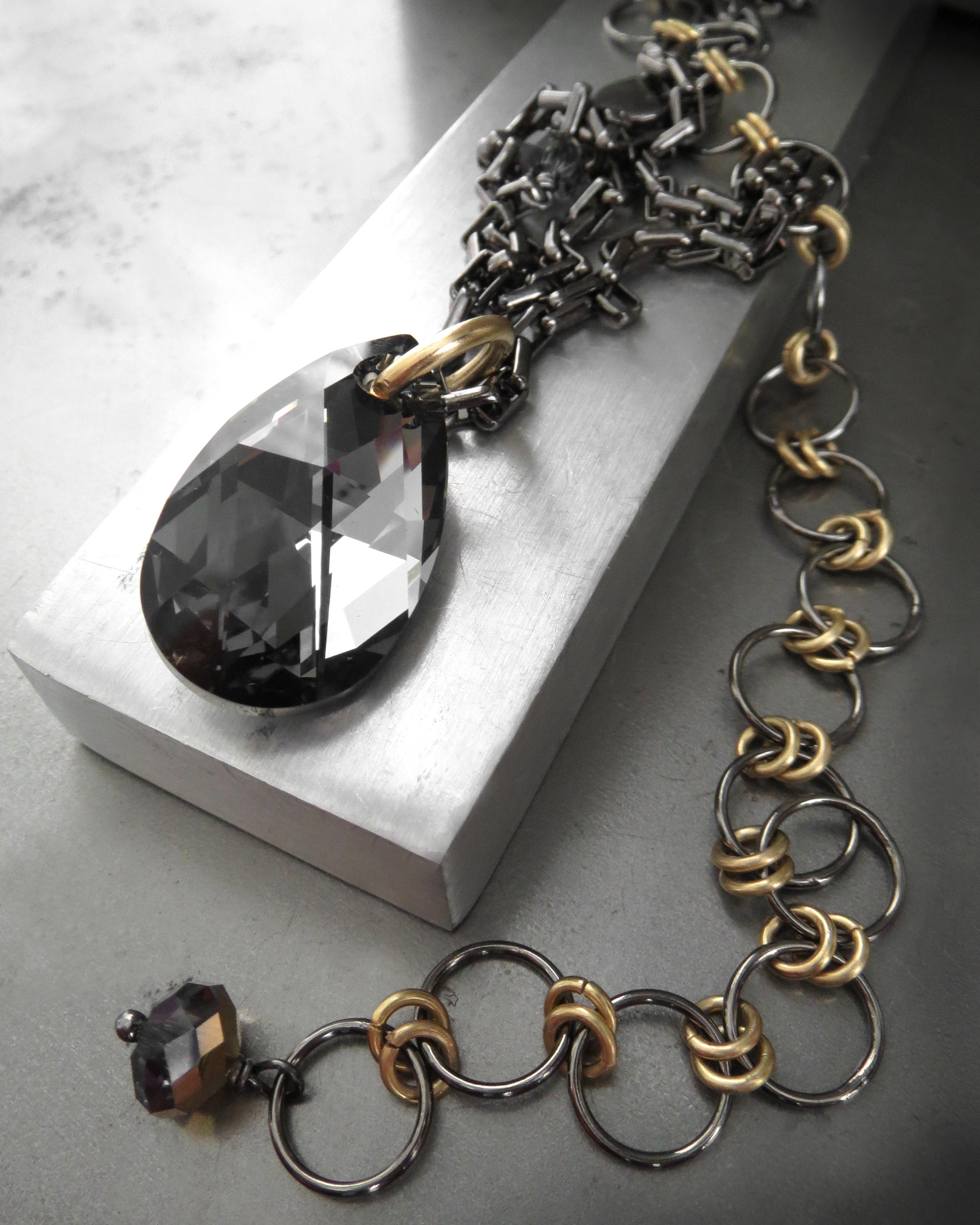 Black Night Crystal Teardrop Pendant Necklace with Gold Accents