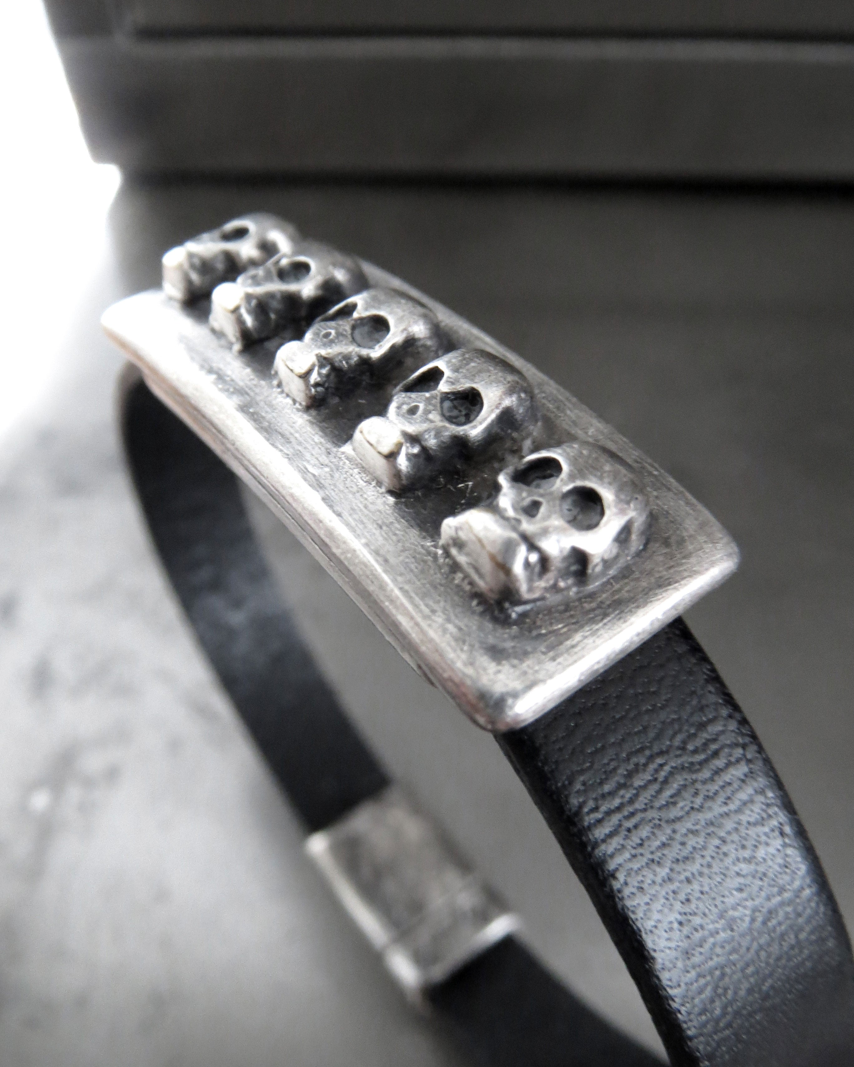 FIVE SKULLS - Black Leather Bracelet with Antiqued Silver Skulls