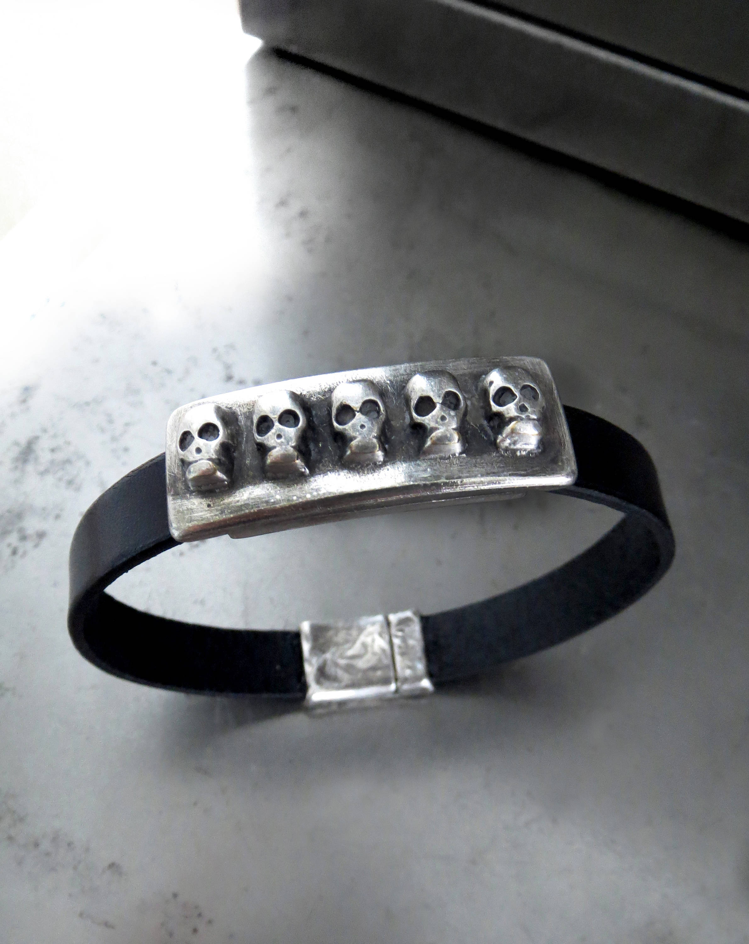 FIVE SKULLS - Black Leather Bracelet with Antiqued Silver Skulls