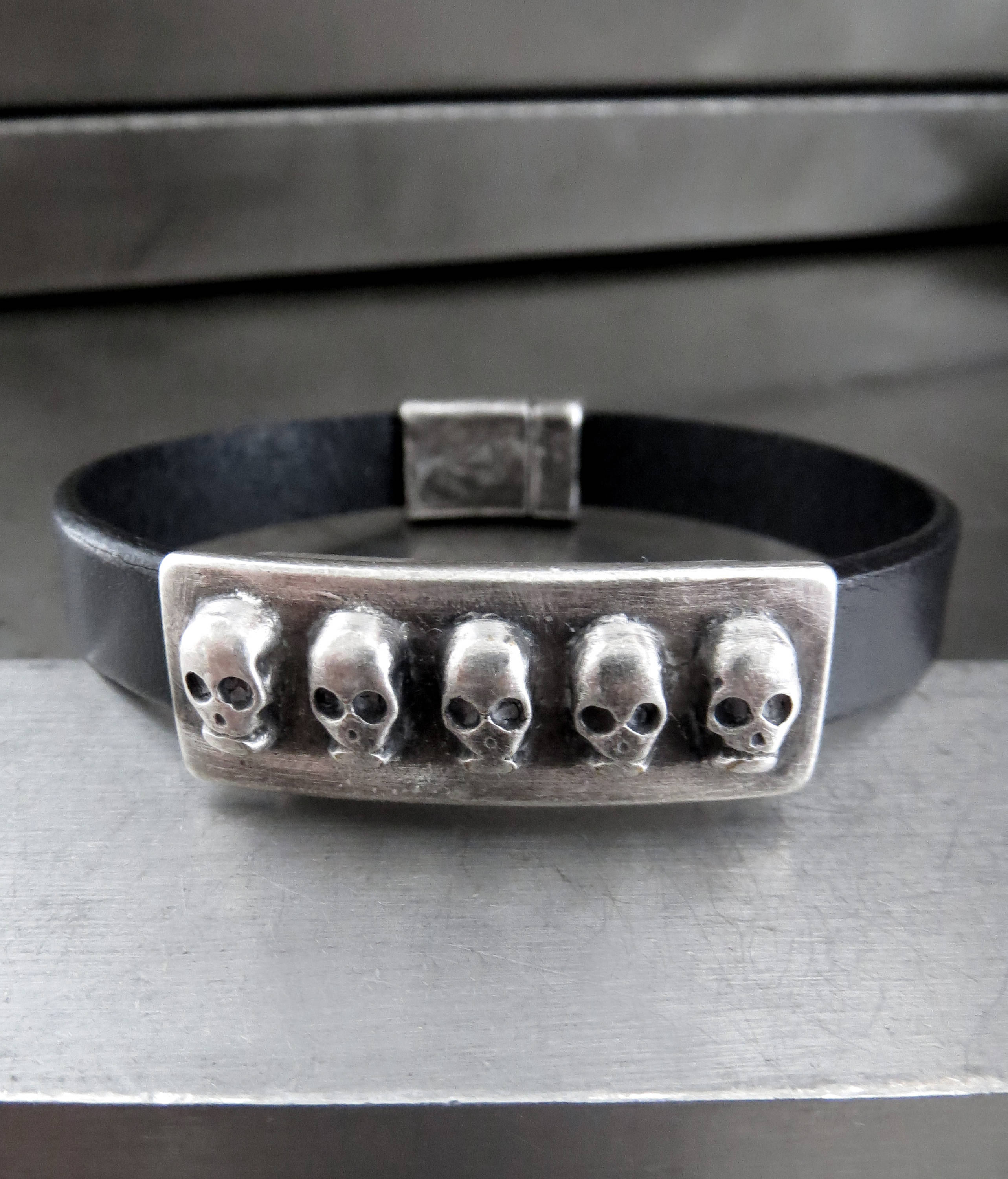 FIVE SKULLS - Black Leather Bracelet with Antiqued Silver Skulls
