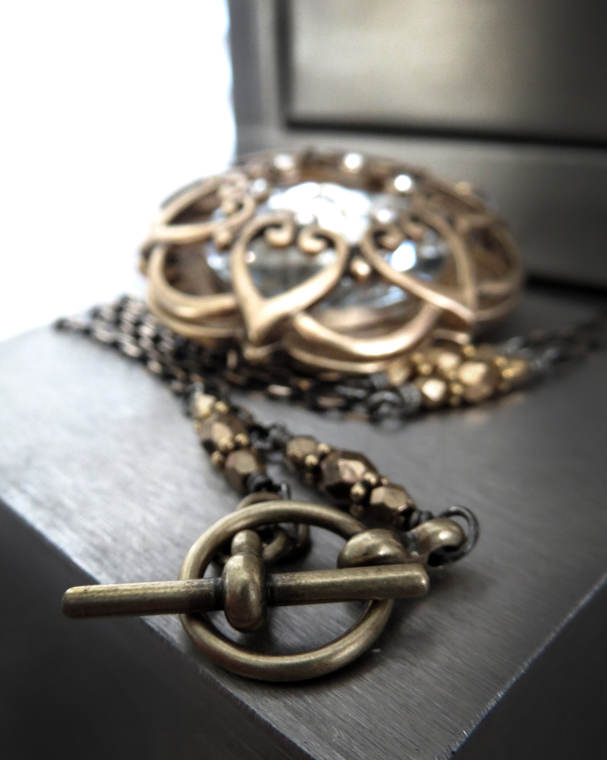 INNER LIGHT - Large Crystal Pendant with Antique Gold Mandala Cage on Black-Gold Chain, Romantic Jewelry for New Years Eve, Valentines Day