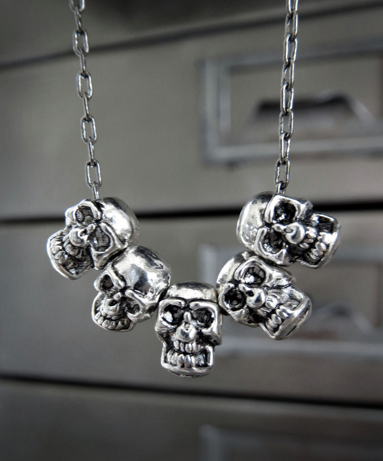 Five Teeny-Tiny Silver Skulls Necklace