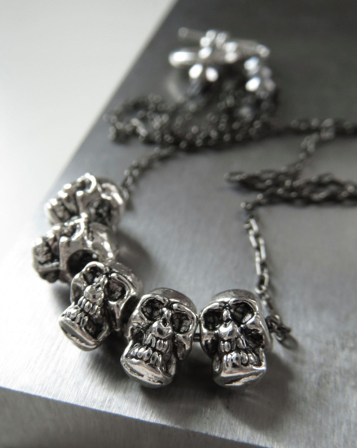 Five Teeny-Tiny Silver Skulls Necklace