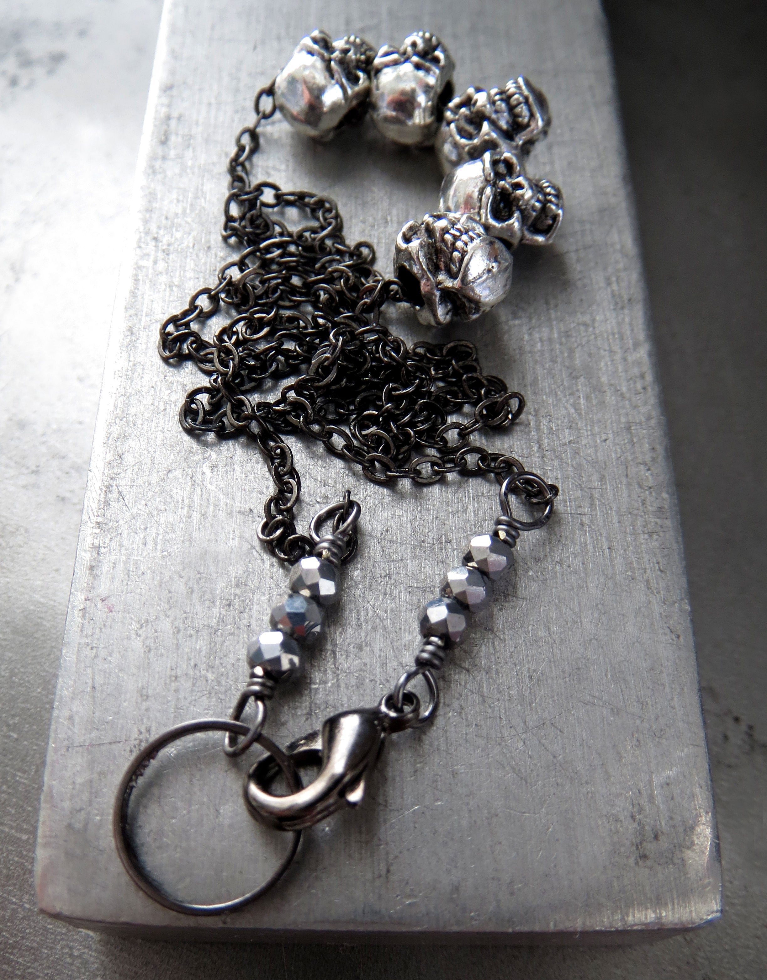 Five Teeny-Tiny Silver Skulls Necklace