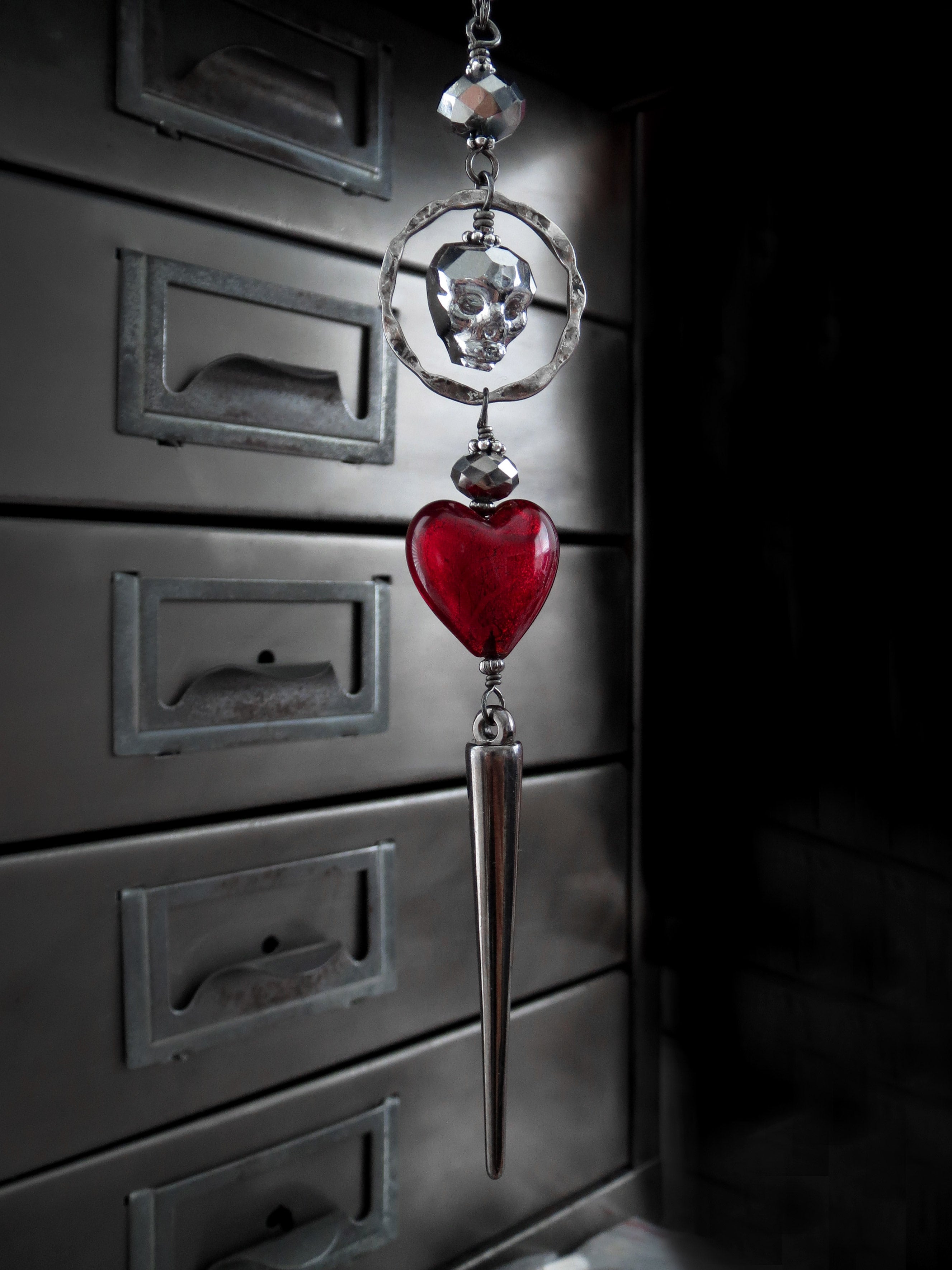 Metallic Silver Skull Necklace with Blood Red Heart Pendant