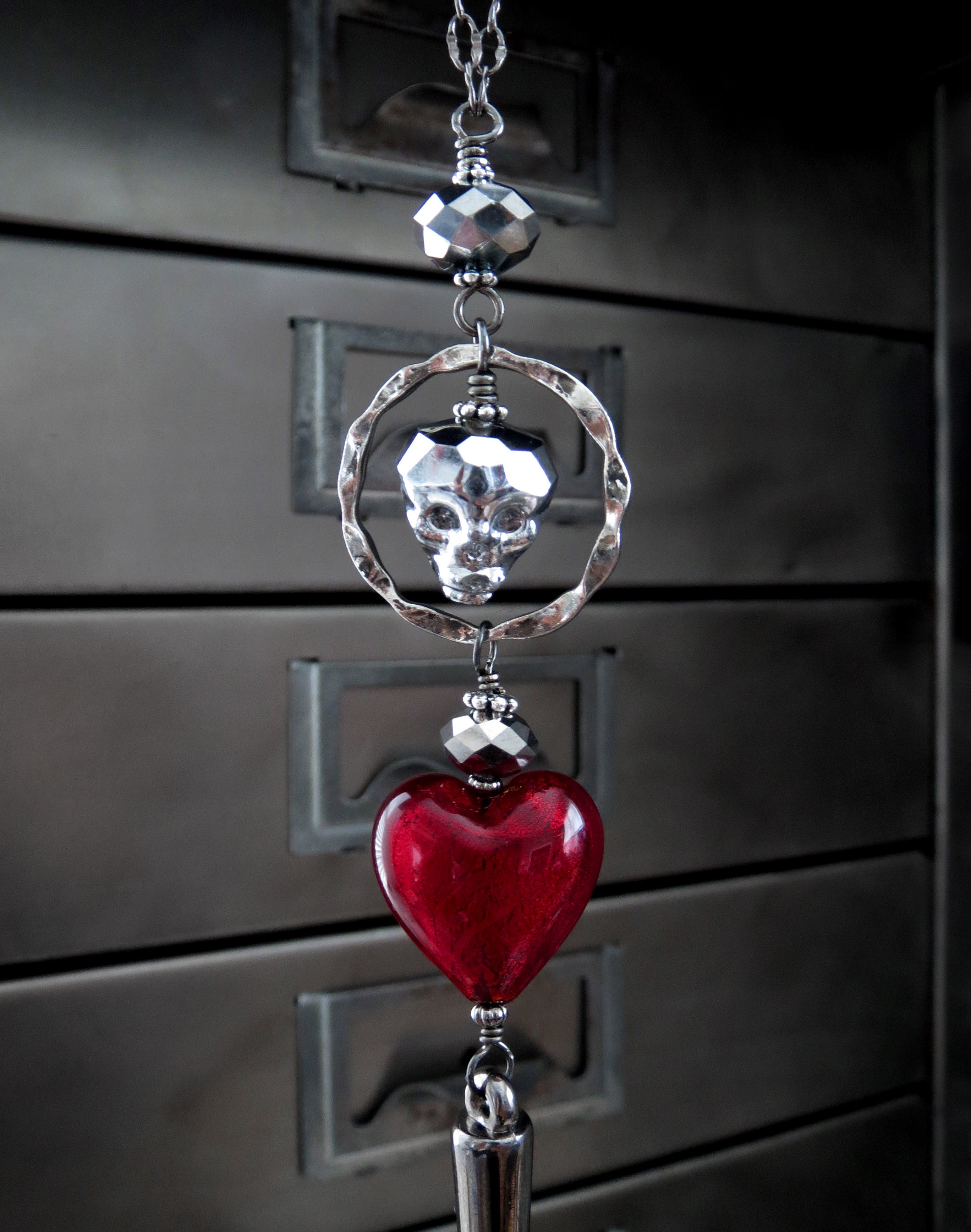 Metallic Silver Skull Necklace with Blood Red Heart Pendant