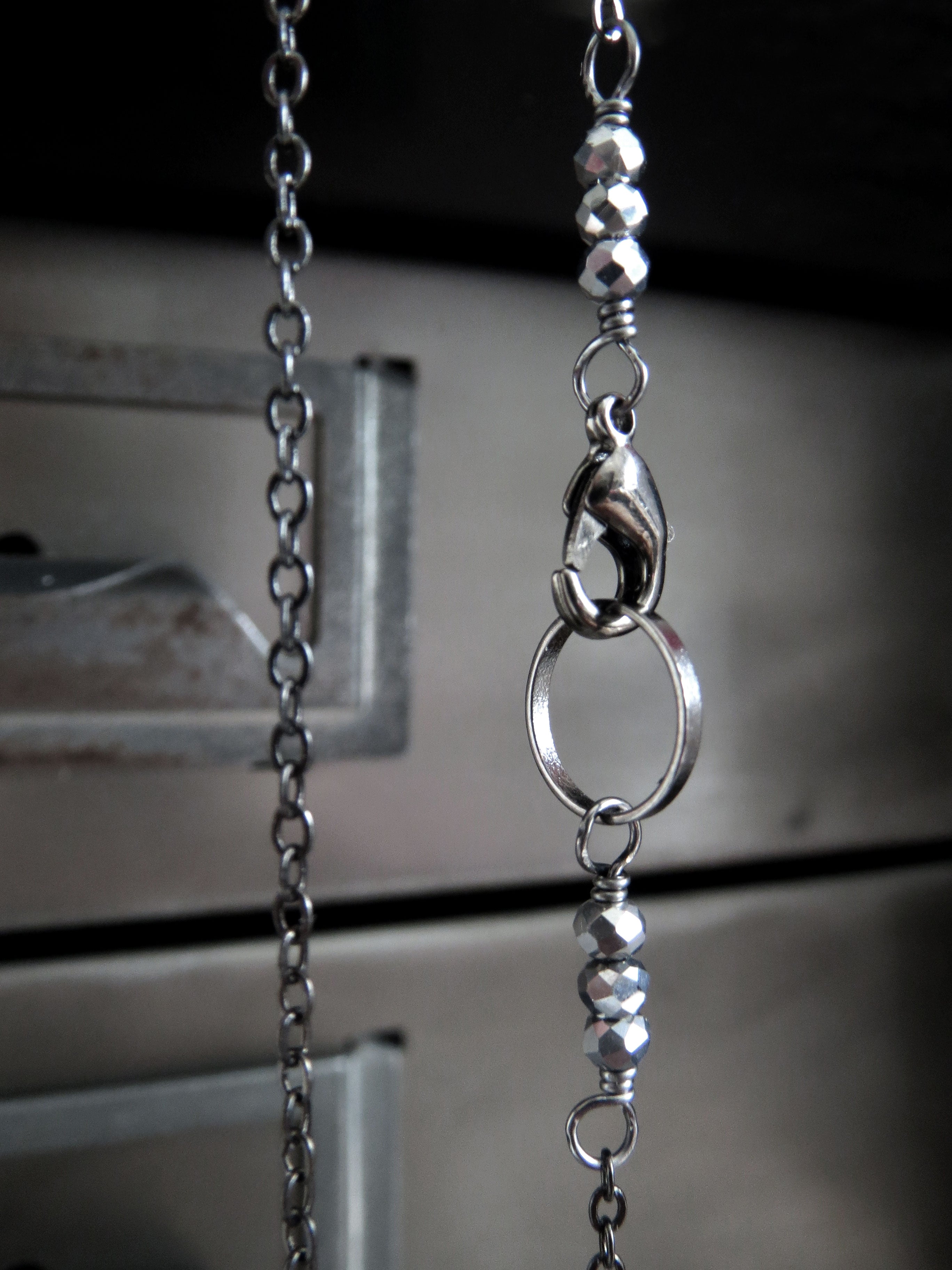 Five Teeny-Tiny Silver Skulls Necklace